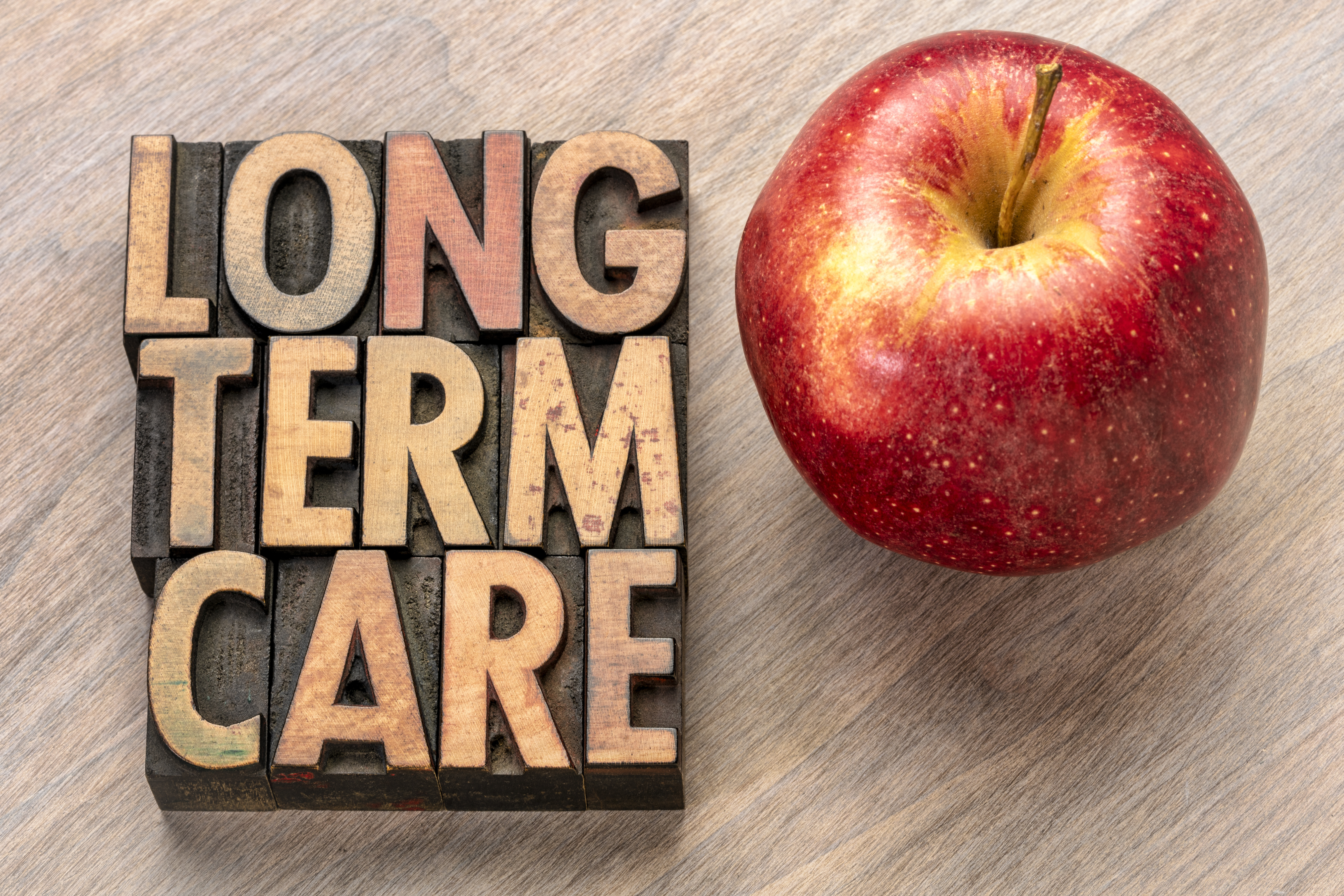 long-term-care-insurance-written-next-to-apple