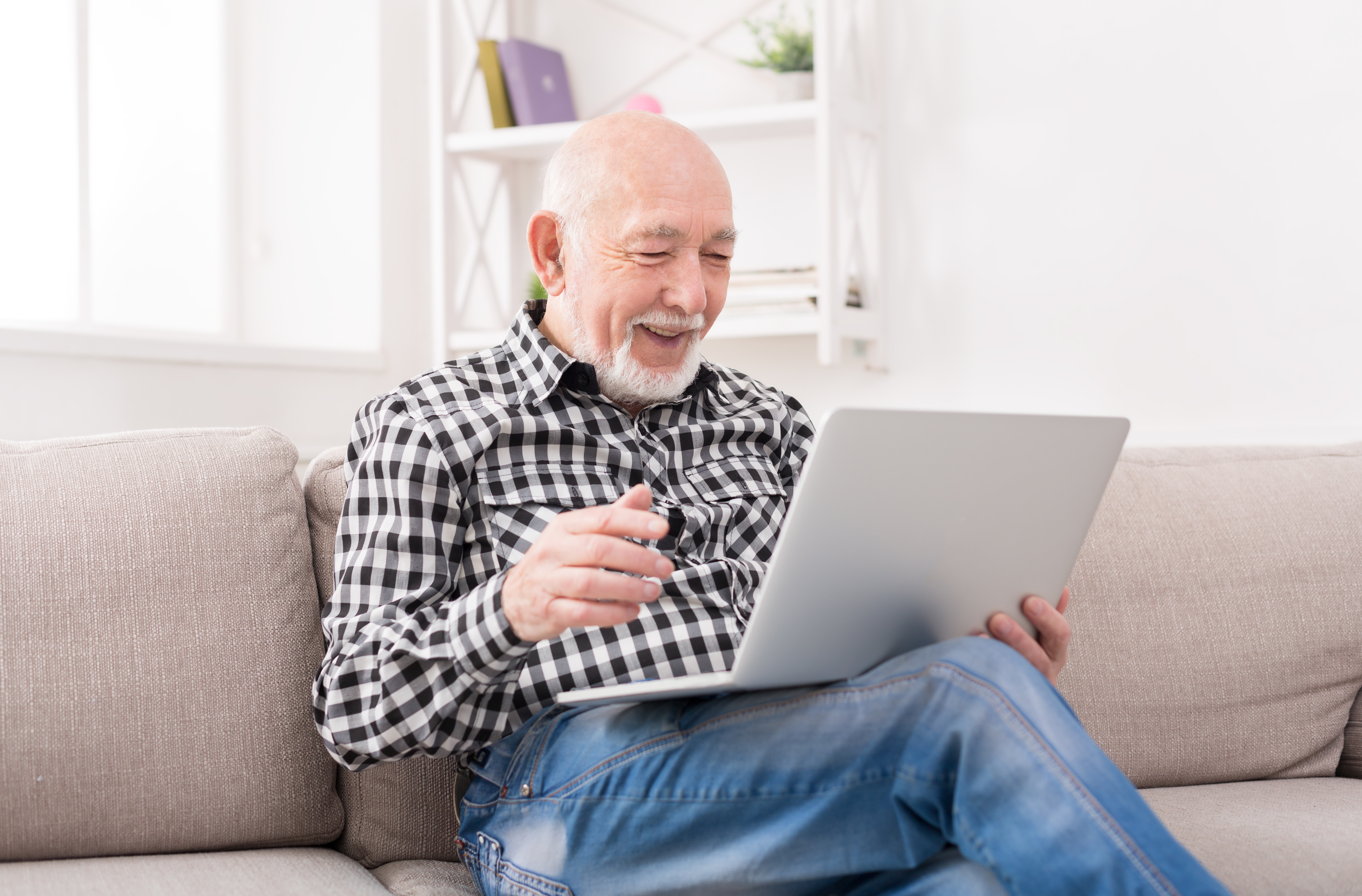 senior-male-using-computer-to-research-life-insurance-options-for-prostate-cancer-patients