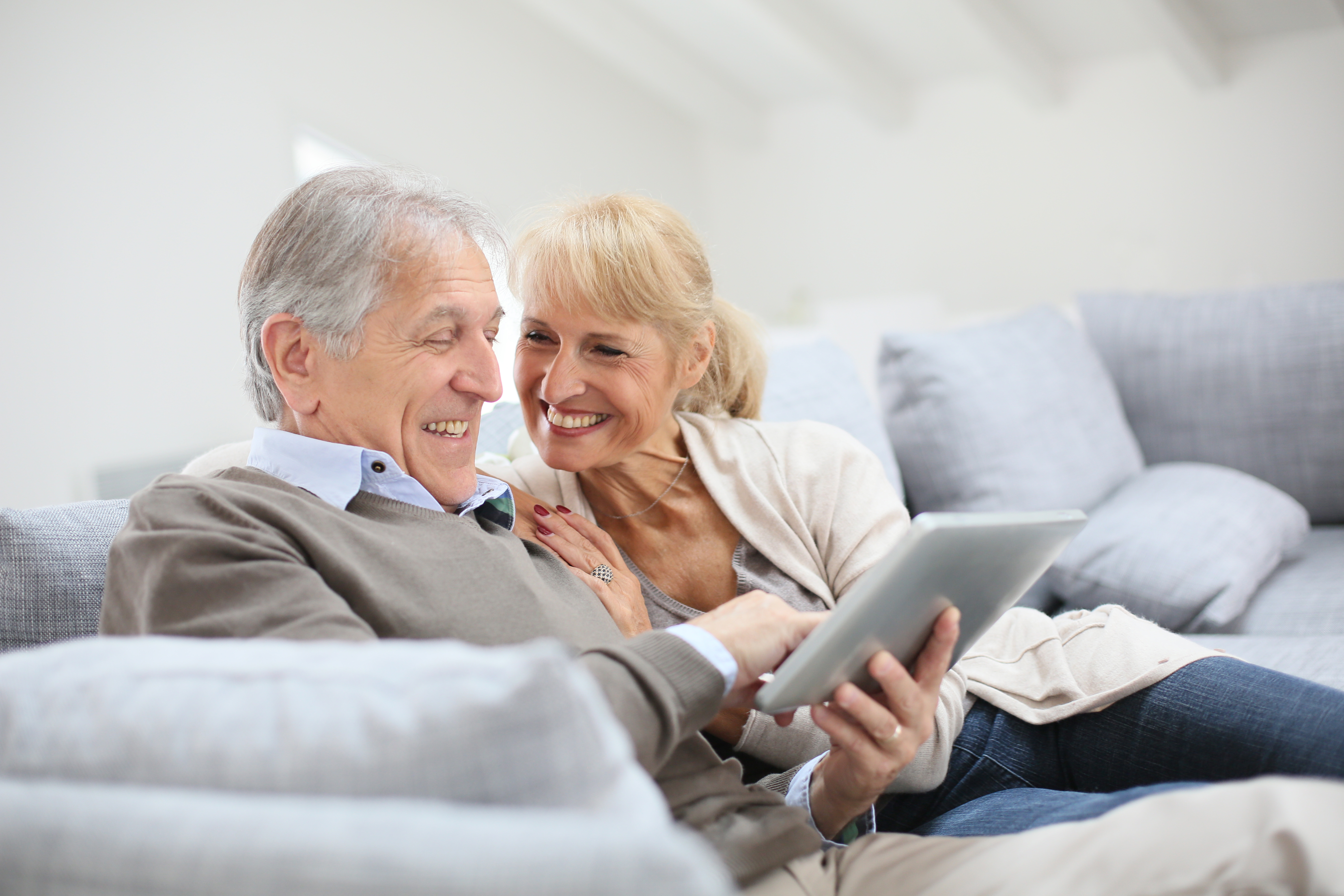 senior-couple-exploring-types-of-medicare-advantage-programs-on-tablet